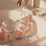 LEAFI Aroma Secret Flower luxury room spray 200ml styled on a bathroom vanity with beauty accessories