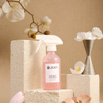 LEAFI Aroma Secret Flower luxury room spray 200ml styled with white orchid flowers on stone podium