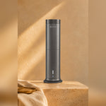 LEAFI Aura 200 Titanium on a travertine pedestal in warm afternoon light