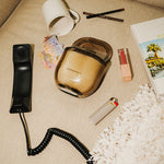 LEAFI Allure Black Oudh & Patchouli candle (400g) in an amber glass jar on a white background.