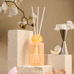 LEAFI Shadows Freesia & Pear home diffuser (200ml) with white flowers on a beige background.