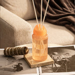 LEAFI Shadows Freesia & Pear home diffuser (200ml) on a table with a blurred background.